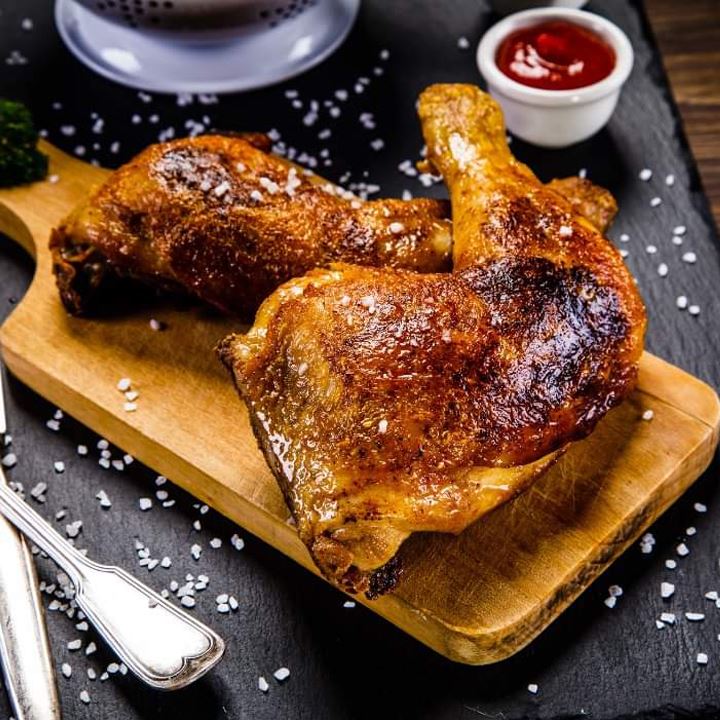 Plate of roast chicken quarters