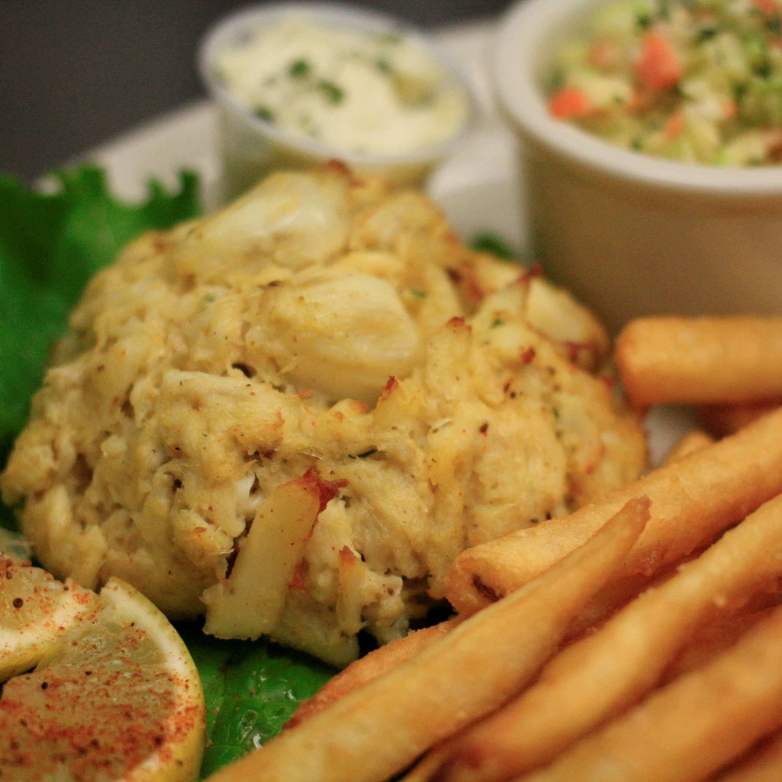 Crab cake, fries, and cole slaw