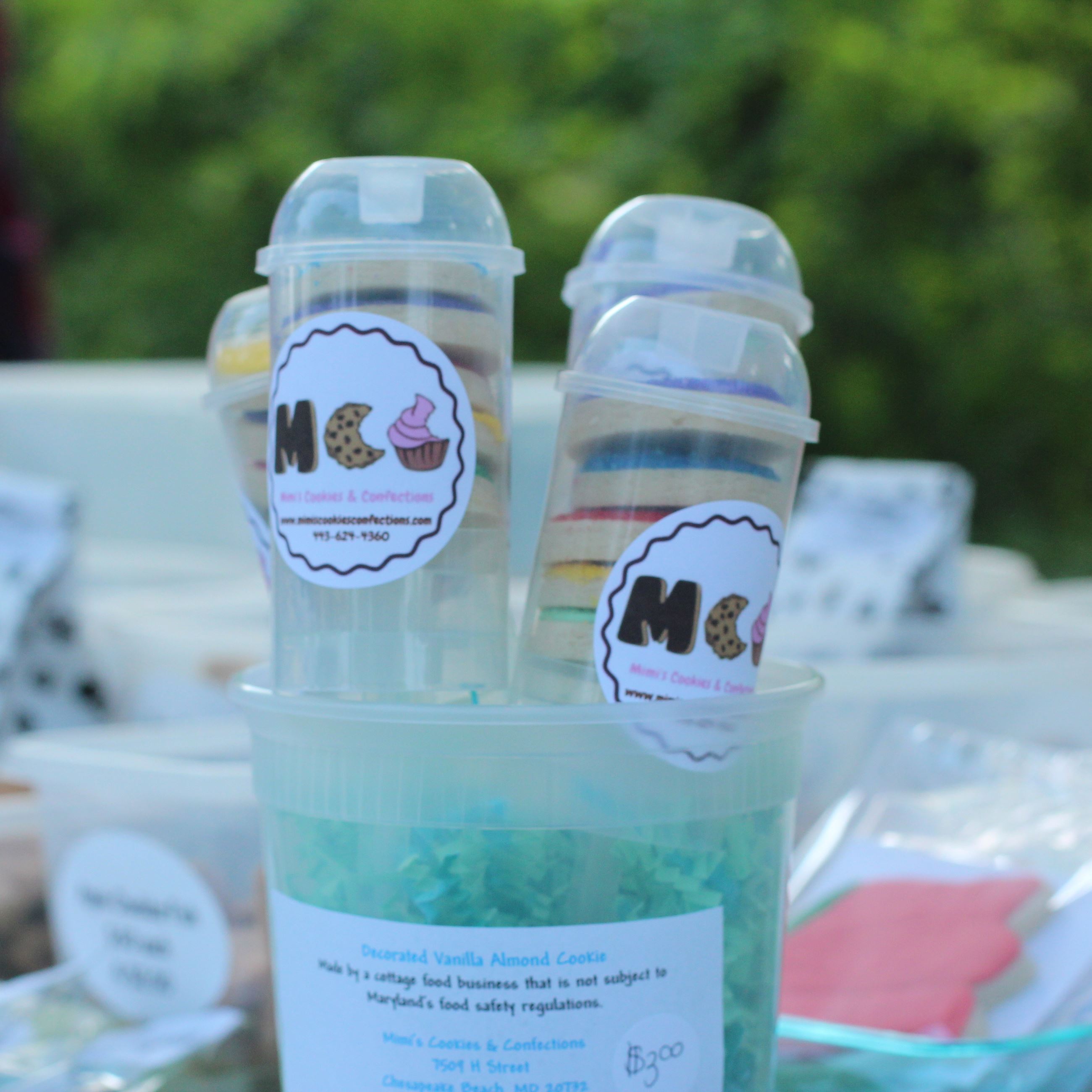 Sugar cookie push pops with sugar cookies in the background