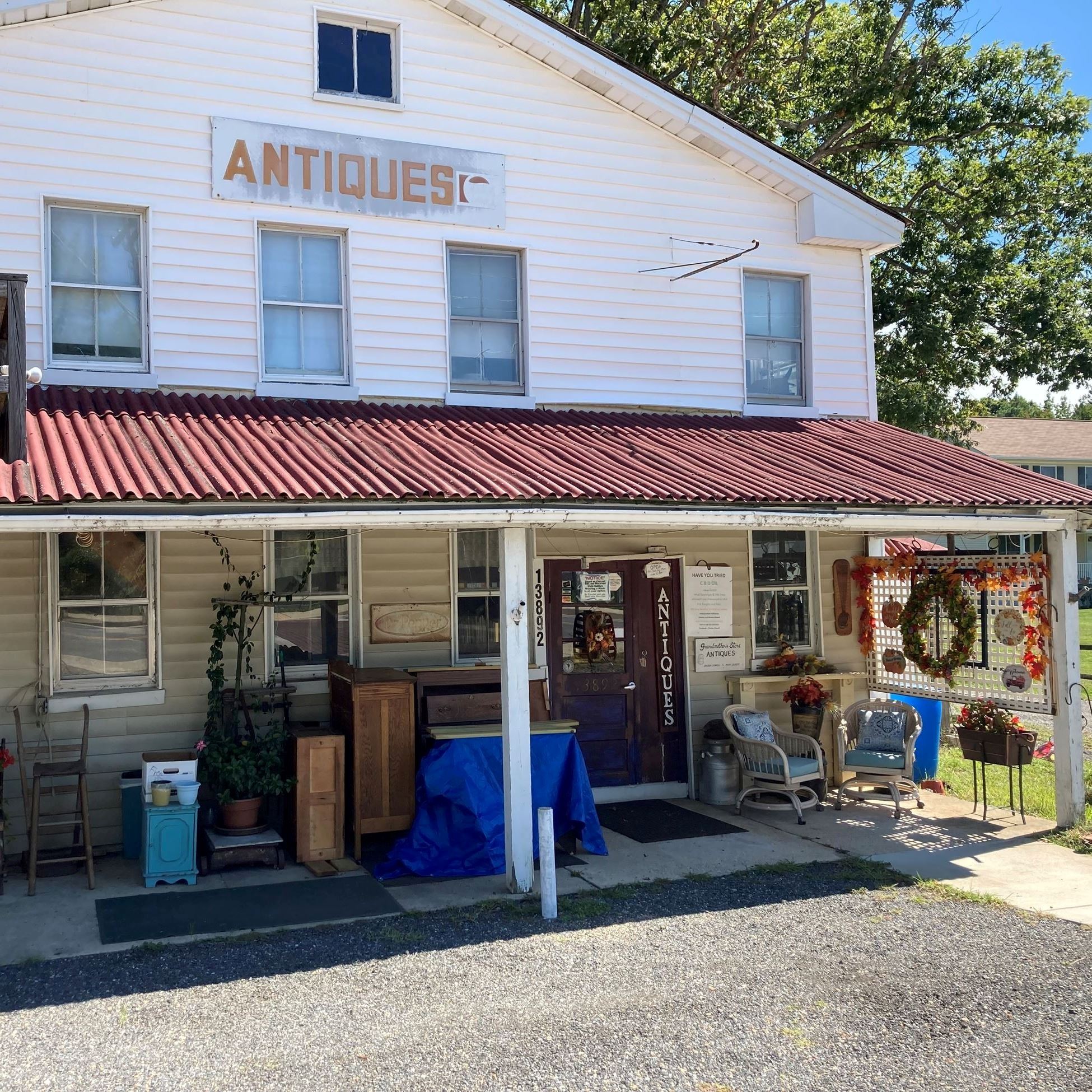 Front porch of shop with red roof