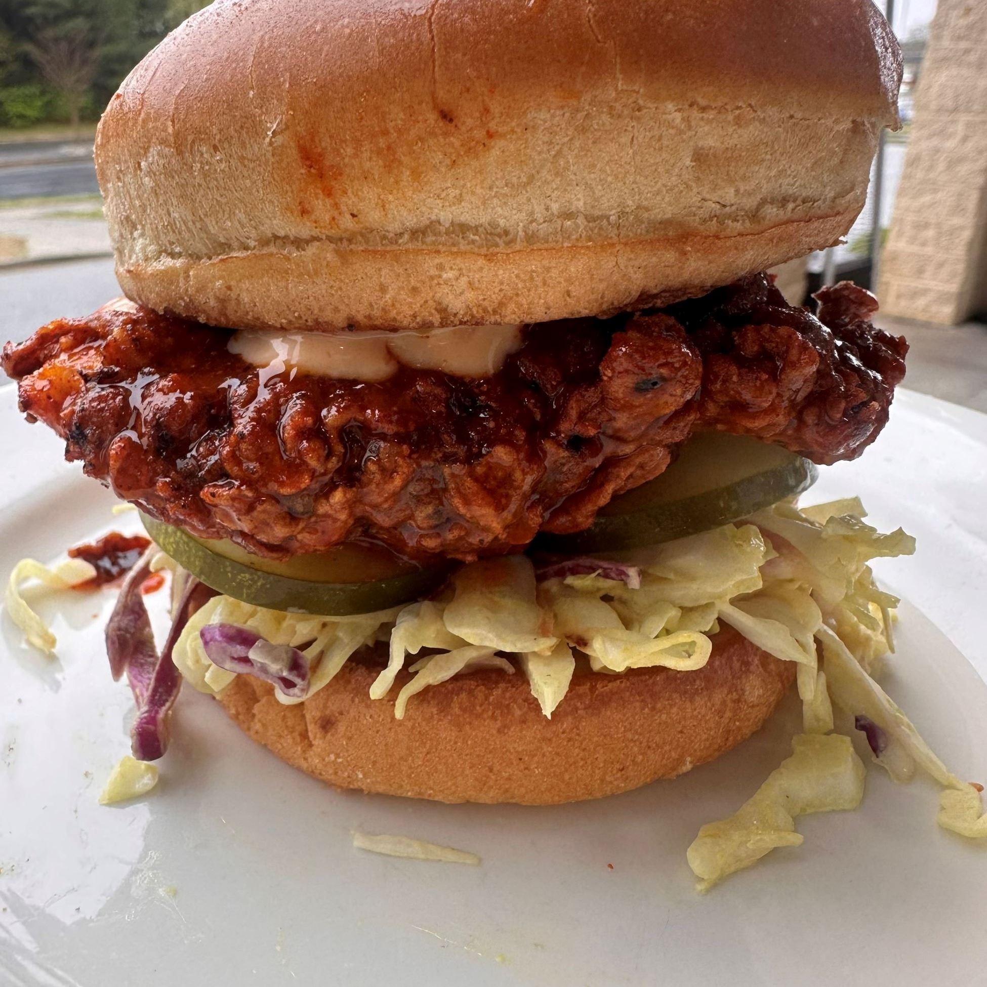burger and coleslaw on a bun